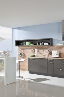 Kitchen with blue walls and wood paneling