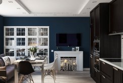 Combined black and white living room and kitchen