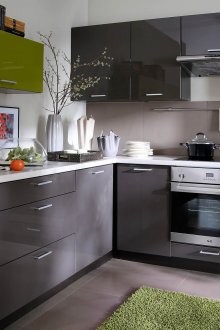 White and gray kitchen with green accents