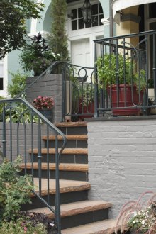Porch with wrought iron stairs