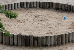 Children's sandbox made of logs