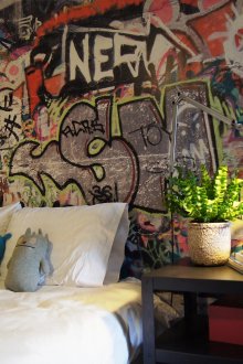 Teenager boy room interior with graffiti and table lamps