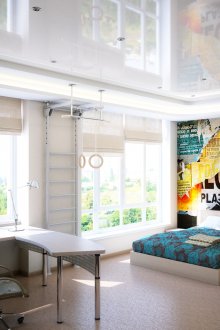 Warm-up area, bed and desk in room for teenager boy