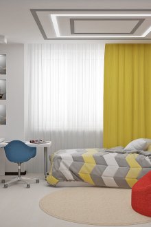 Bright room with a red ottoman for a teenager