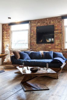 Living room with wooden furniture in loft style.
