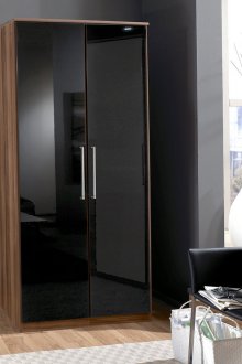 Glossy narrow wardrobe in the bedroom