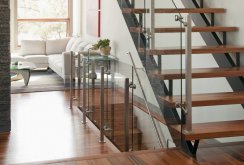 Metal staircase with glass railing.