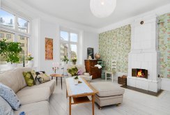 Bright living room with a rustic fireplace