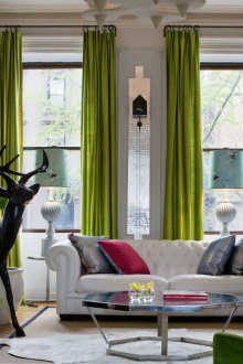 Green curtains on a high window