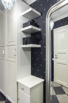 Black wallpaper with white polka dots for the hallway