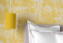 Yellow wallpaper with a white pattern