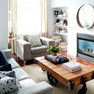Small boho style living room with wooden table