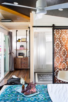 Cozy boho style bedroom with sliding doors