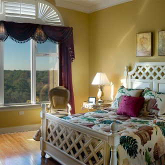 Bedroom with a large boho-style window