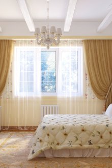 Kertas dinding kuning dan bunga di dalam bilik tidur