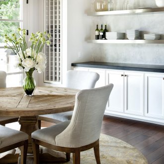 Scandinavian-style kitchen with wooden table and chairs