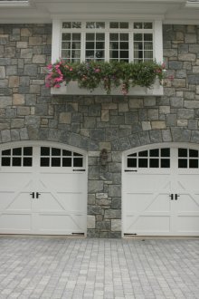 Siding under a decorative stone