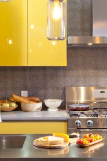 Metal goes well with yellow in the kitchen