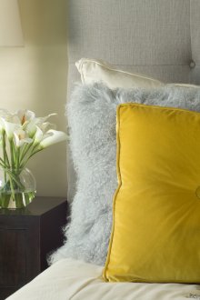 Yellow pillows and vases in the bedroom