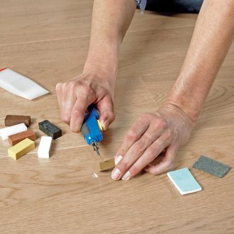Laminate repair with wax crayons