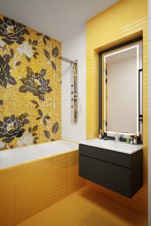 Yellow tiles and mosaics with a pattern in the bathroom