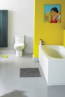 Yellow furniture and part of the wall in the bathroom