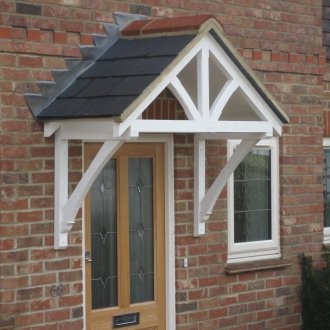 Visor above the entrance of a brick house