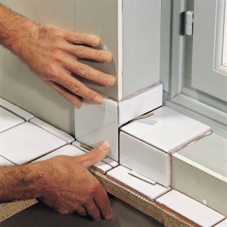 Meletakkan jubin di dinding drywall