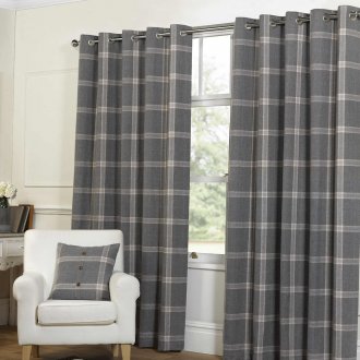 Gray plaid curtains on the grommets in the white living room