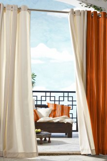 Cream and orange curtains to separate the space