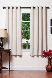 Creamy short curtains on grommets