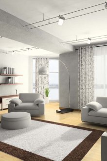 Gray-white curtains on grommets in the interior