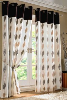 Brown-cream curtains on the grommets in the interior