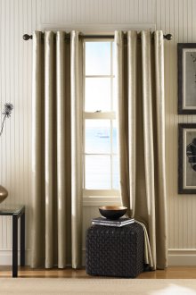 Golden blackout curtains on grommets