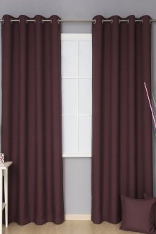 Burgundy curtains on grommets