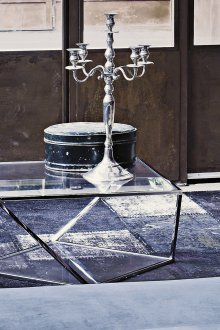 Unusual coffee table made of metal and glass