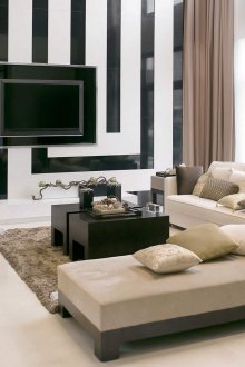 Бежови, бели и черни цветове в интериора на хола в модерен стил