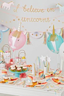 Decoration of children's party table with unicorns.