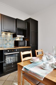 The furnishings of a studio apartment and a black kitchen interior