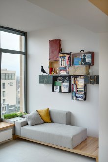 Furnishing studio apartment with wall shelves