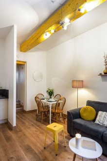 Furnishing studio apartment with yellow accents