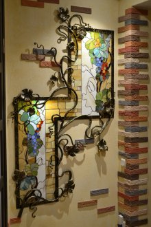 Stained glass windows with wrought iron elements in the hallway
