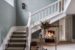 Corridor design with white staircase