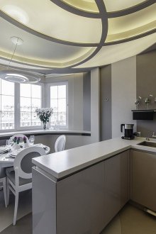 Refrigerator under the window with a balcony
