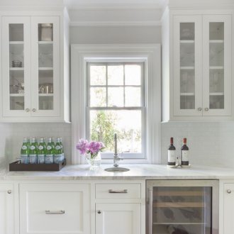 The refrigerator under the window is built-in