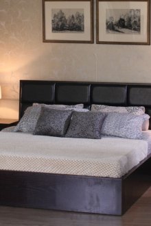 Black bedside tables in the bedroom