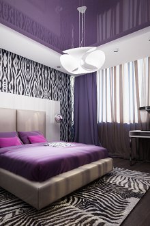 Комбинацията от лилаво, черно и бяло в спалнята