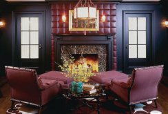 Burgundy, black and brown colors in the living room interior