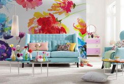 Large bright flowers in the design of wallpaper in the living room