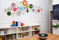 Bright plates on the wall in a bright kitchen